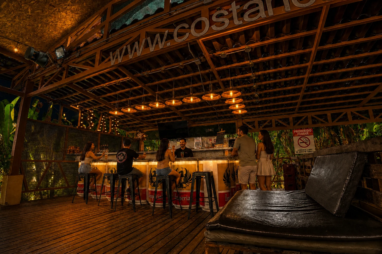 Barra Imperial at Arenal Backpackers Resort with guests gathered around the bar