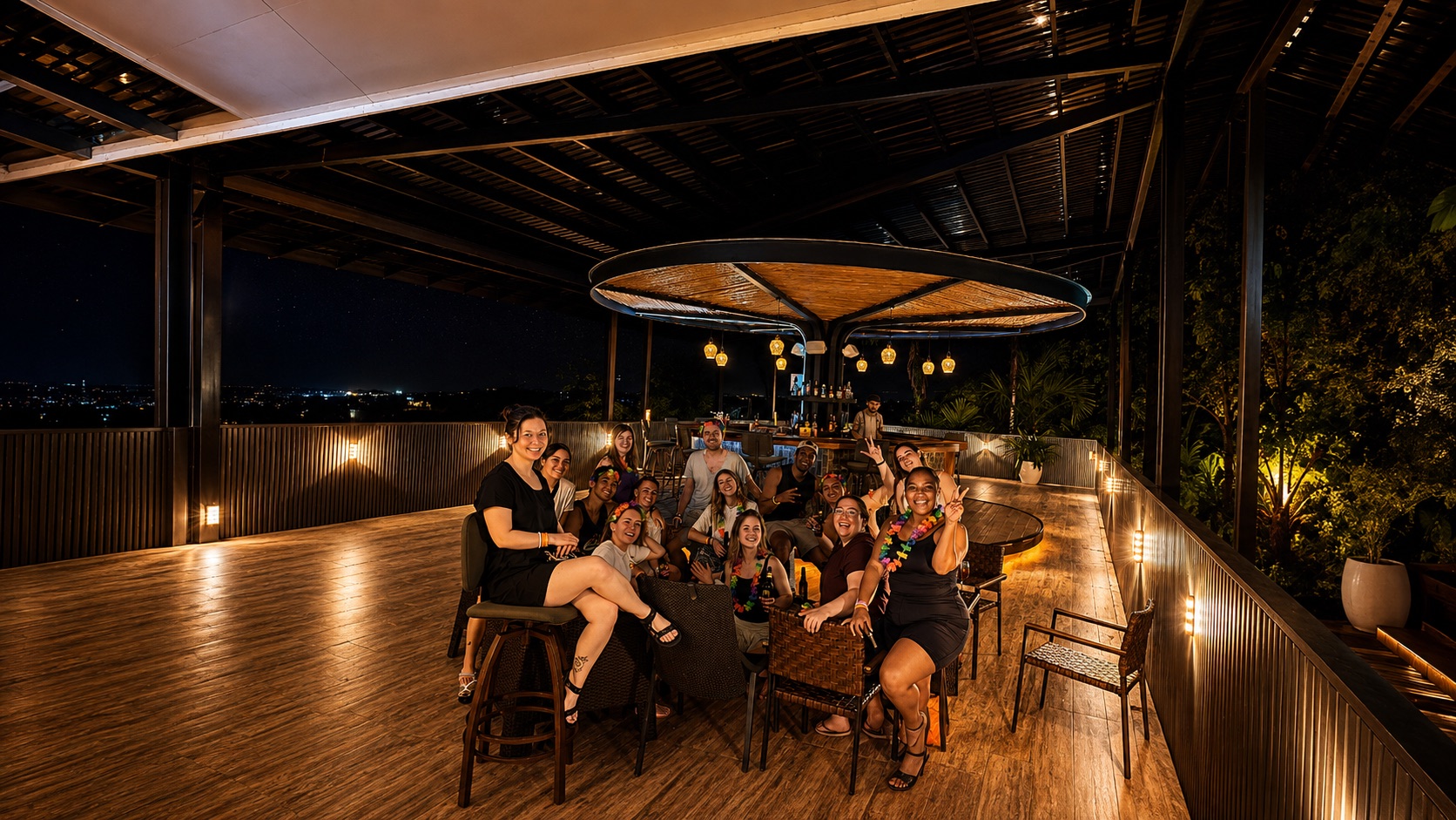 Arenal Backpackers team and guests at the rooftop bar