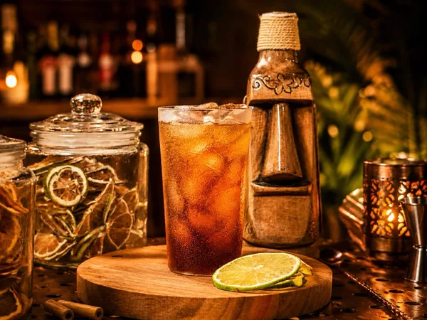 A cocktail with a beer on the side