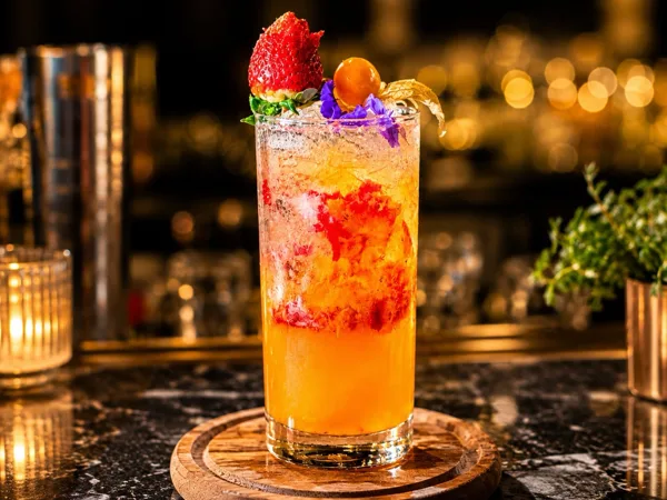 A bright fruit-garnished cocktail