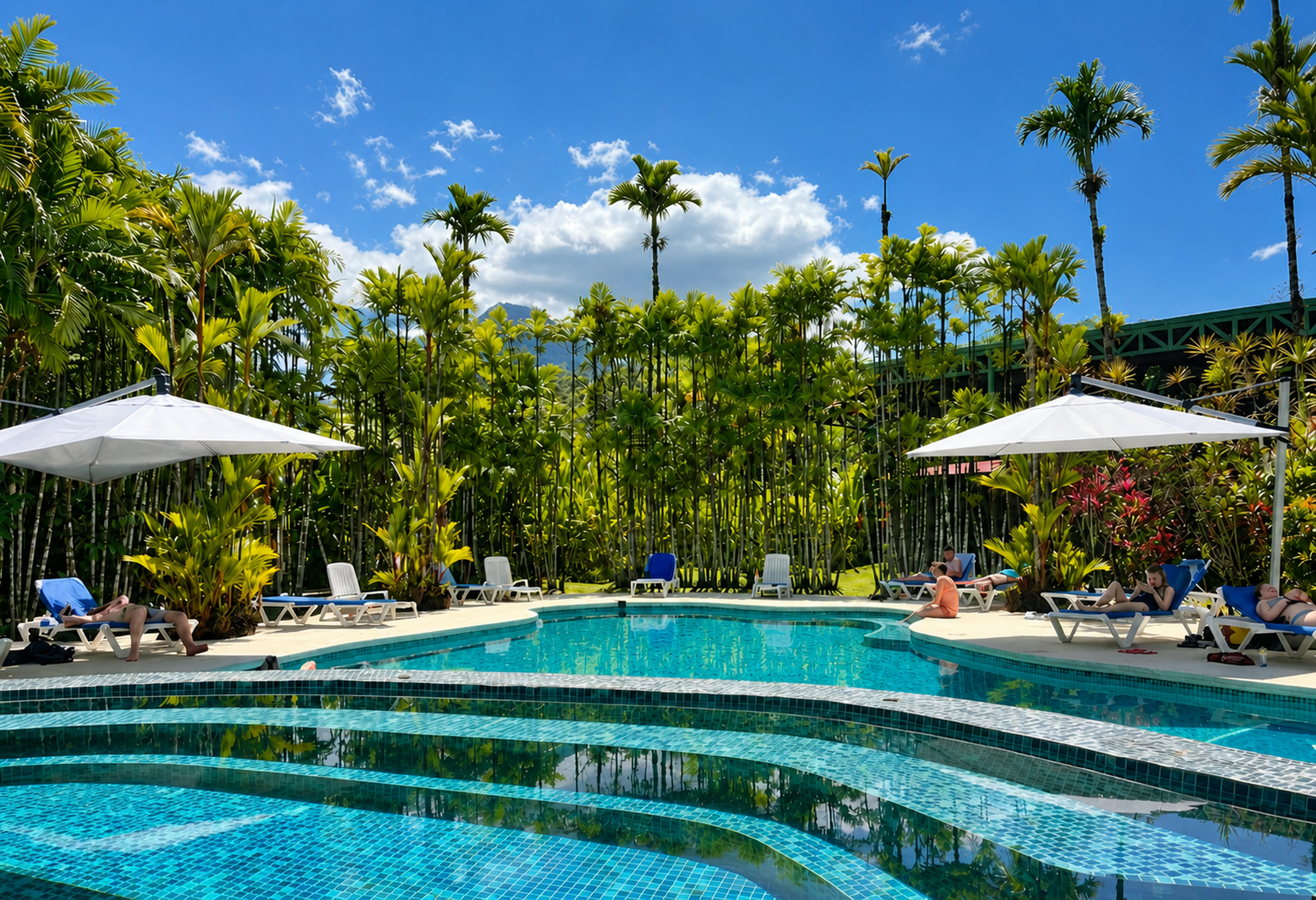 Pool and tropical gardens at Arenal Backpackers Resort in La Fortuna, Costa Rica
